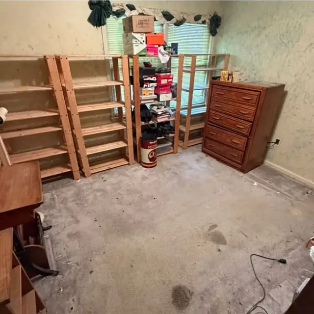 After: the room cleared with only shelving and a dresser left