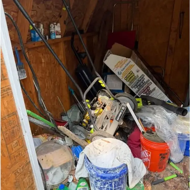 Before: a shed packed with buckets, tools, a mower and clutter