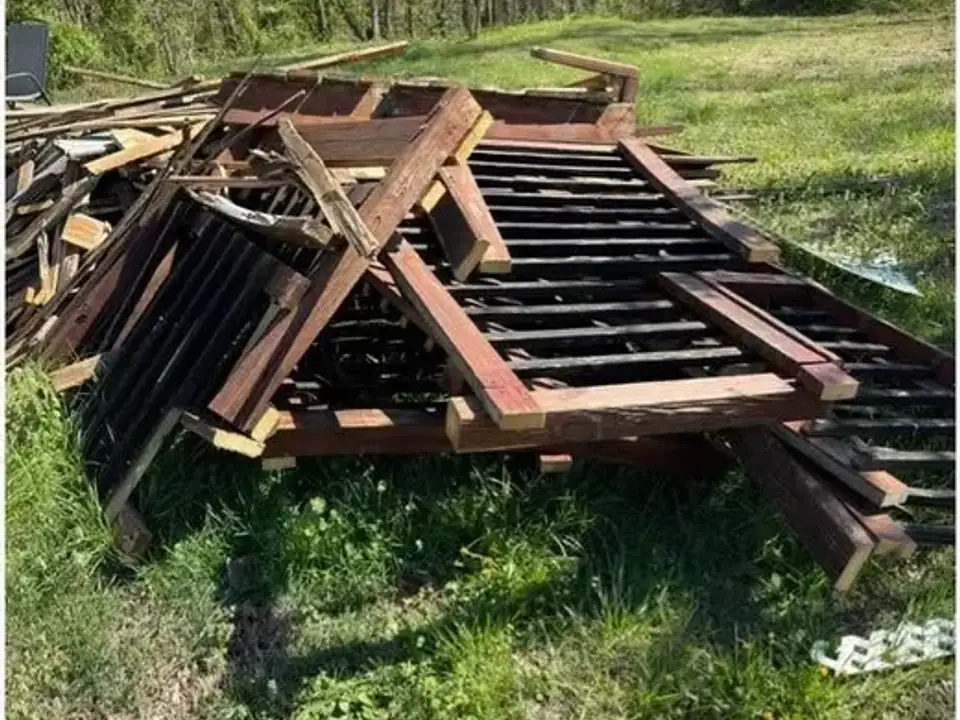 Before: a pile of scrap wood and debris in the yard